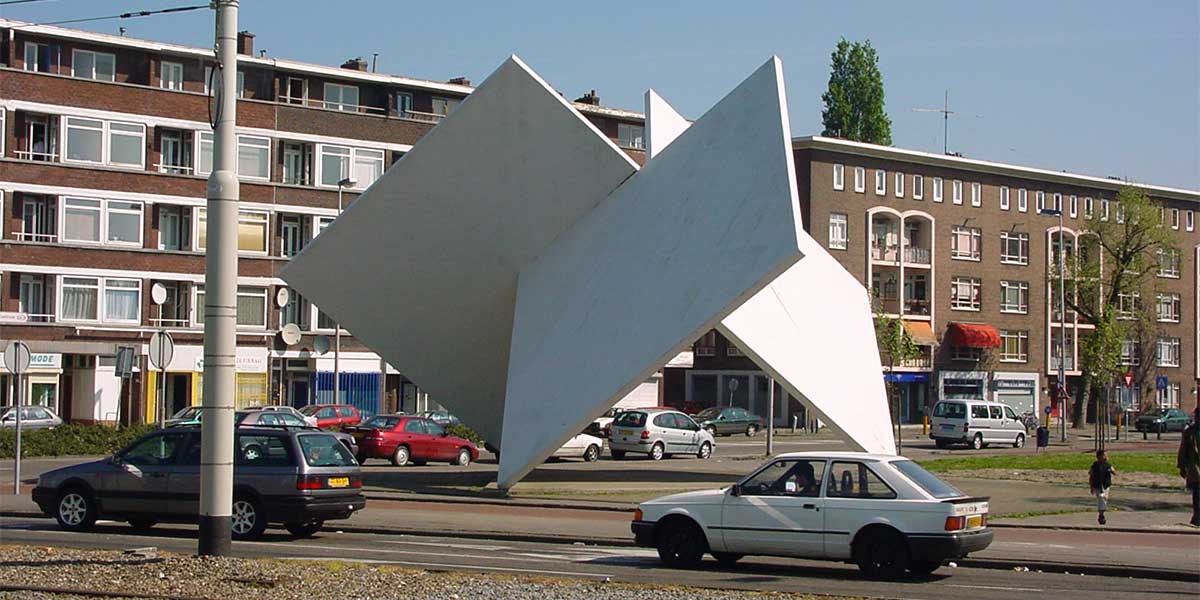 Positioned at the projecting corner of the junction, the sculpture acquires maximum exposure to movement from multiple directions.